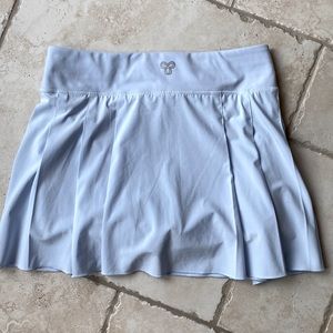 TNA Action Skort with inside pocket in light blue. 15” waist and 14” length